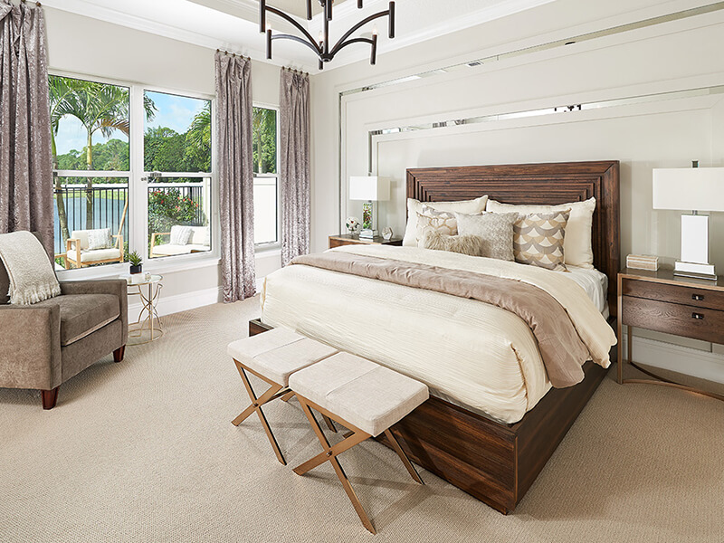 Bedroom with palm tree outside the window