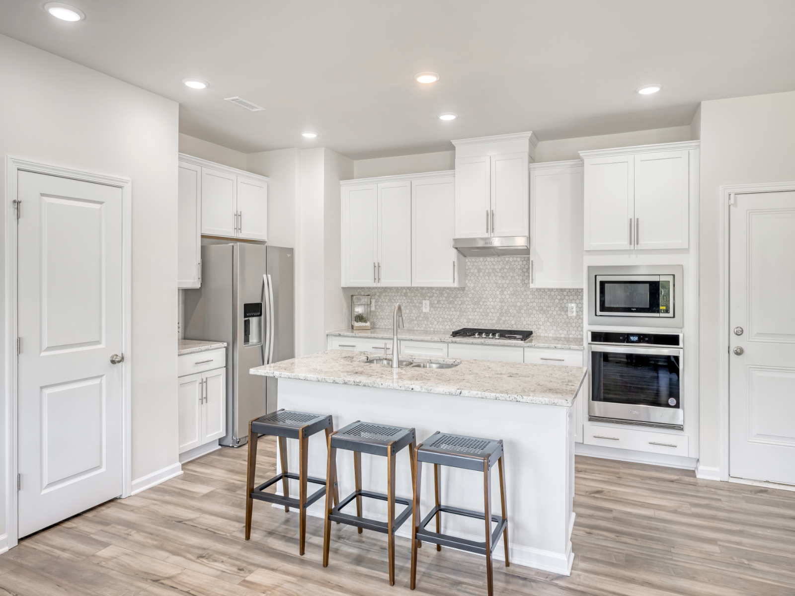 Kitchen in the Lennon floorplan at a Meritage Homes community in Garner, NC.