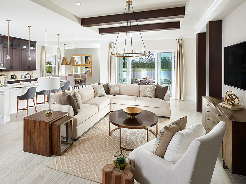 Living room with large white couch and wooden coffee table