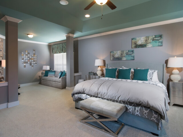 Bedroom with beige carpet and aqua ceilings