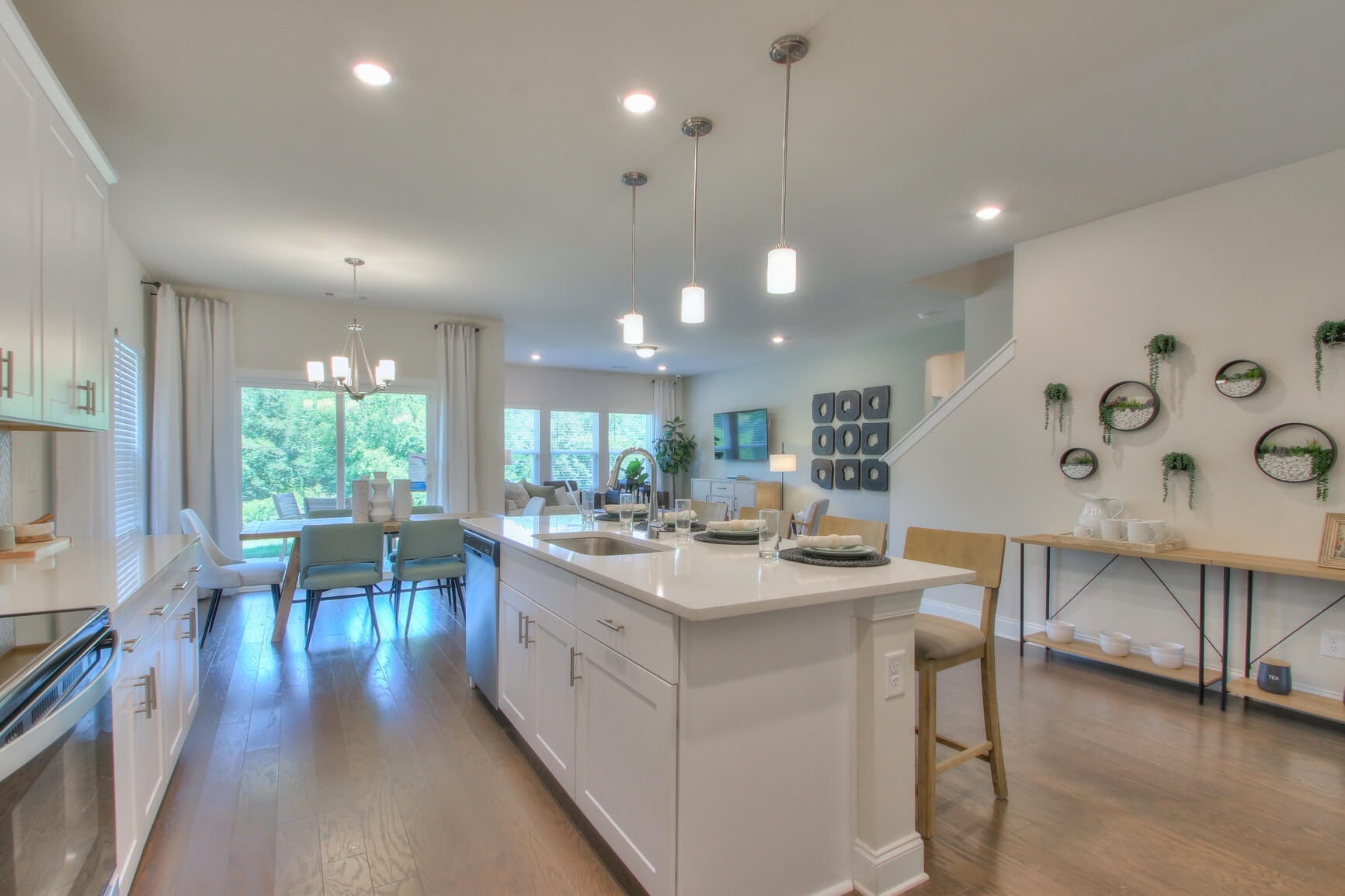 Prep dinner in the kitchen while entertaining guests.