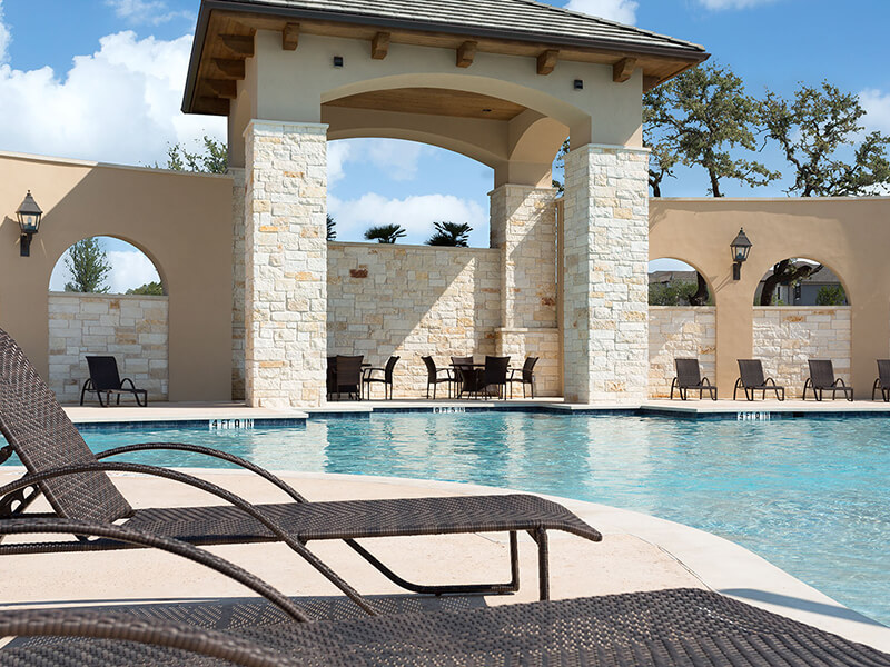 Pool with stone wall and pillars