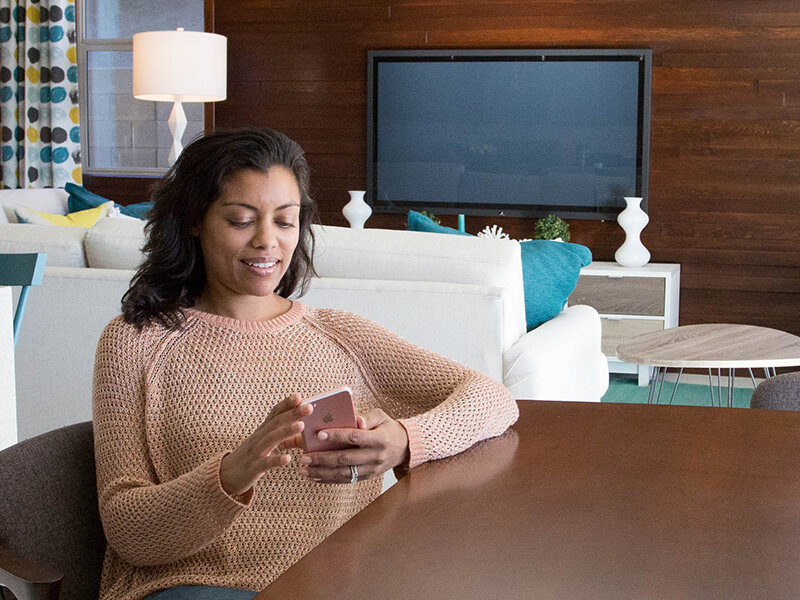 Woman personalizing her buyer portal on her smartphone