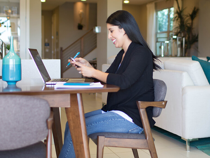 Woman sitting at a desk with a laptop computer