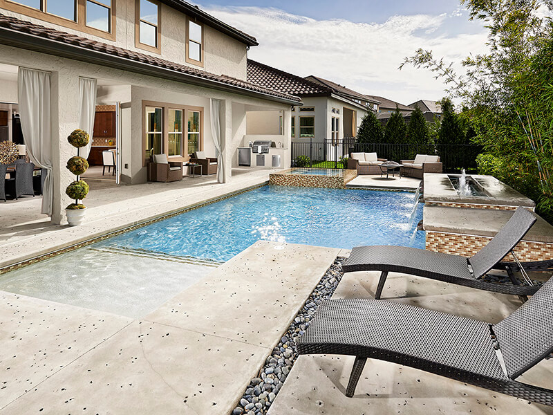 Outdoor pool area with hot tub