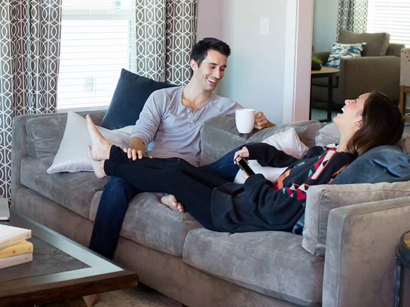 Man and woman relaxing on a couch