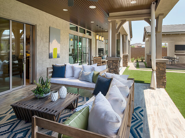 Covered outdoor patio with wooden coffee table