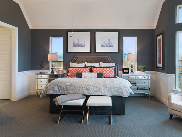 Bedroom with grey carpet and blue walls