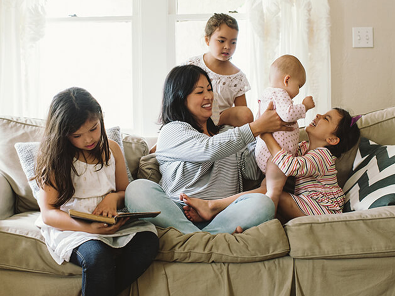 Family sitting on a couch